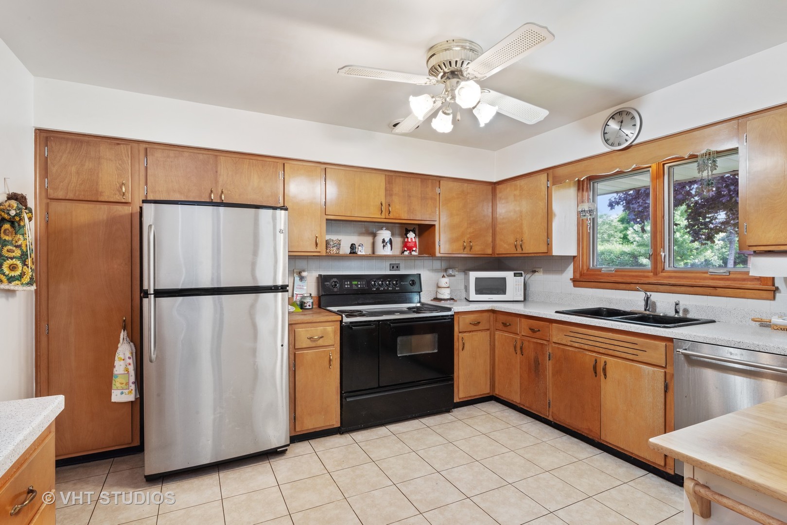 540 Briarhill Road Glenview, IL 60025 - Photo 5 of 19 a kitchen with stainless steel appliances granite countertop a refrigerator a sink dishwasher a stove top oven a refrigerator with island and chairs