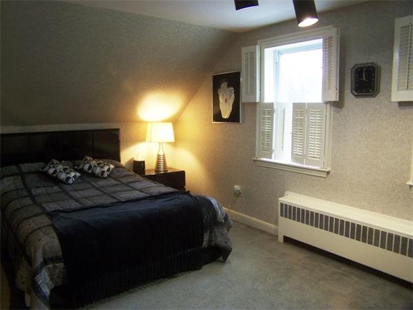 15 Bellevue Road Andover, MA 01810 - Photo 18 of 30 a bedroom with a bed and a window