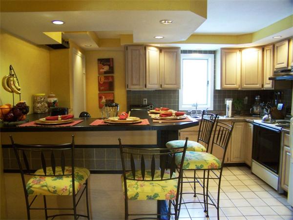 15 Bellevue Road Andover, MA 01810 - Photo 10 of 30 a kitchen with a sink and chairs