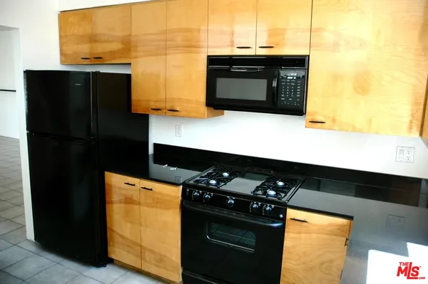a kitchen with a sink and a stove