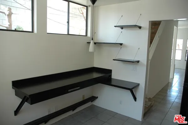 a kitchen with stainless steel appliances a refrigerator and a stove
