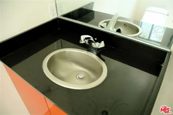 a bathroom with a sink and toilet