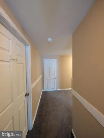 a view of an empty room and a window