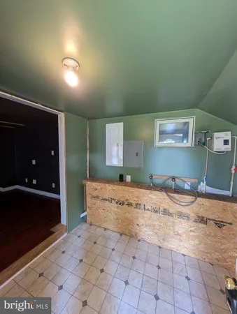 a large room with a bed and furniture