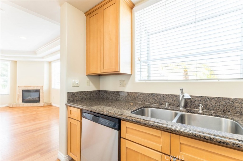 511 East Harvard Road, Unit 101 Burbank, CA 91501 - Photo 9 of 29 a kitchen with granite countertop a sink and a window