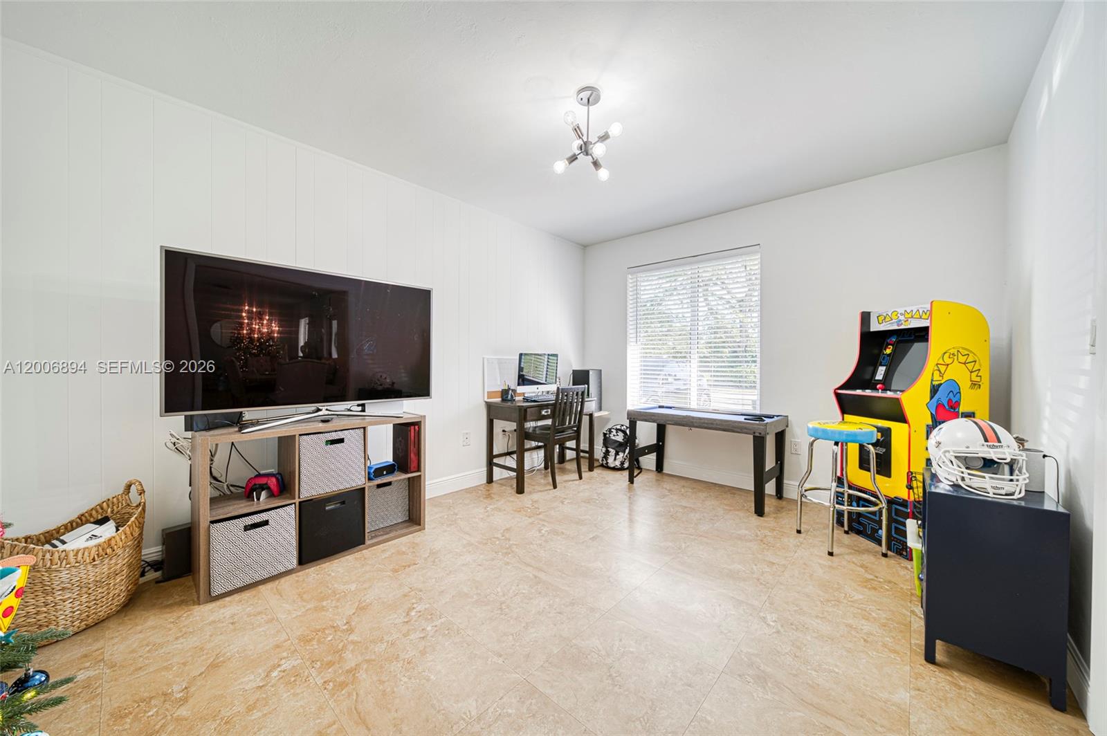 10600 Southwest 80th Court Miami, FL 33156 - Photo 19 of 51 a living room with furniture and a flat screen tv