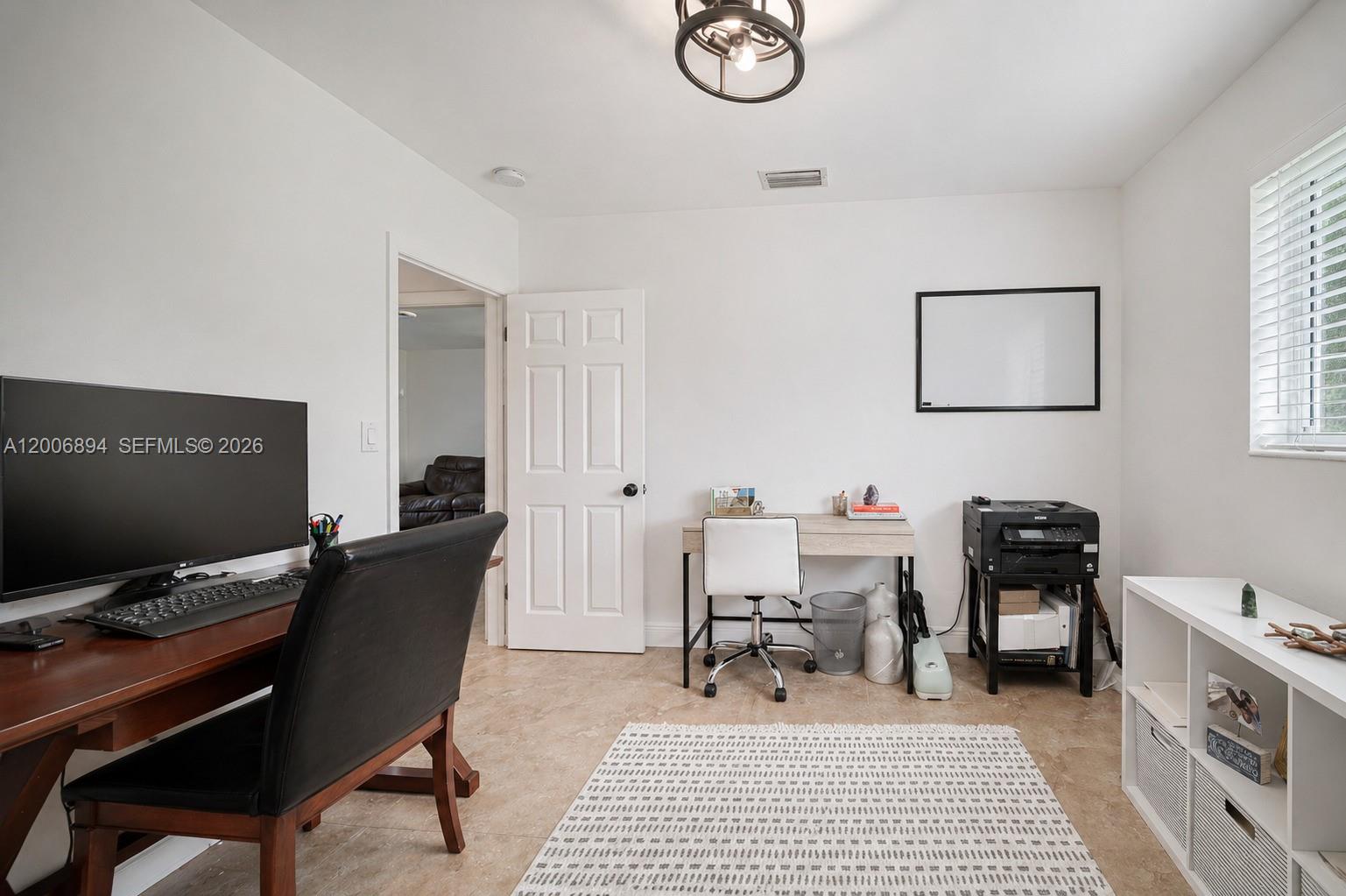 10600 Southwest 80th Court Miami, FL 33156 - Photo 22 of 51 a view of a workspace with furniture