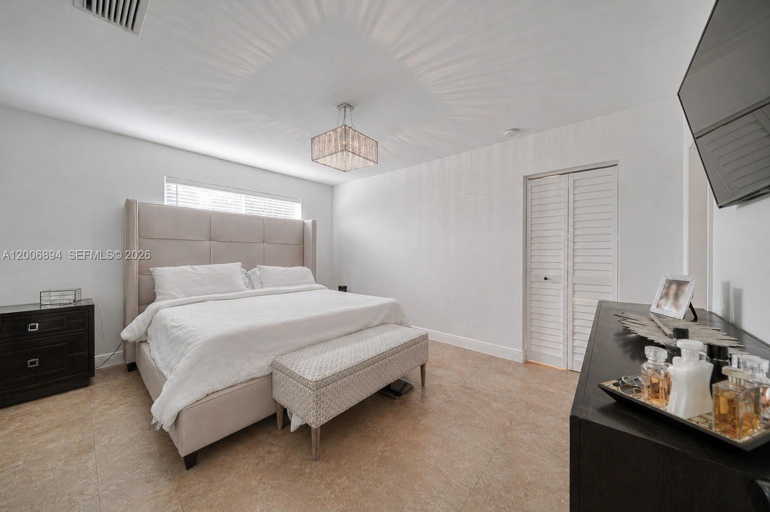 10600 Southwest 80th Court Miami, FL 33156 - Photo 25 of 51 a bedroom with a bed and window
