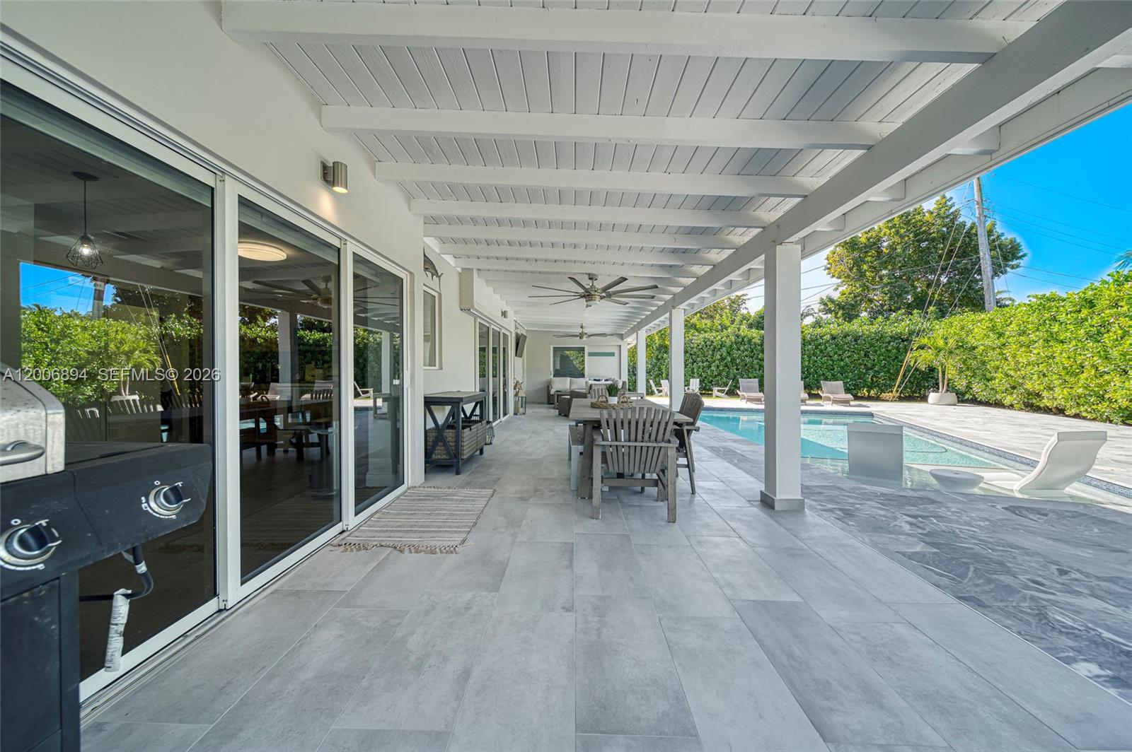 10600 Southwest 80th Court Miami, FL 33156 - Photo 30 of 51 a view of a porch with chairs and backyard