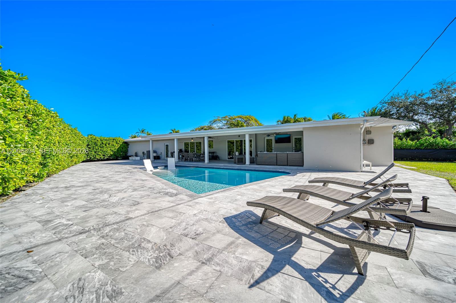 10600 Southwest 80th Court Miami, FL 33156 - Photo 36 of 51 a view of a house with backyard porch and sitting area