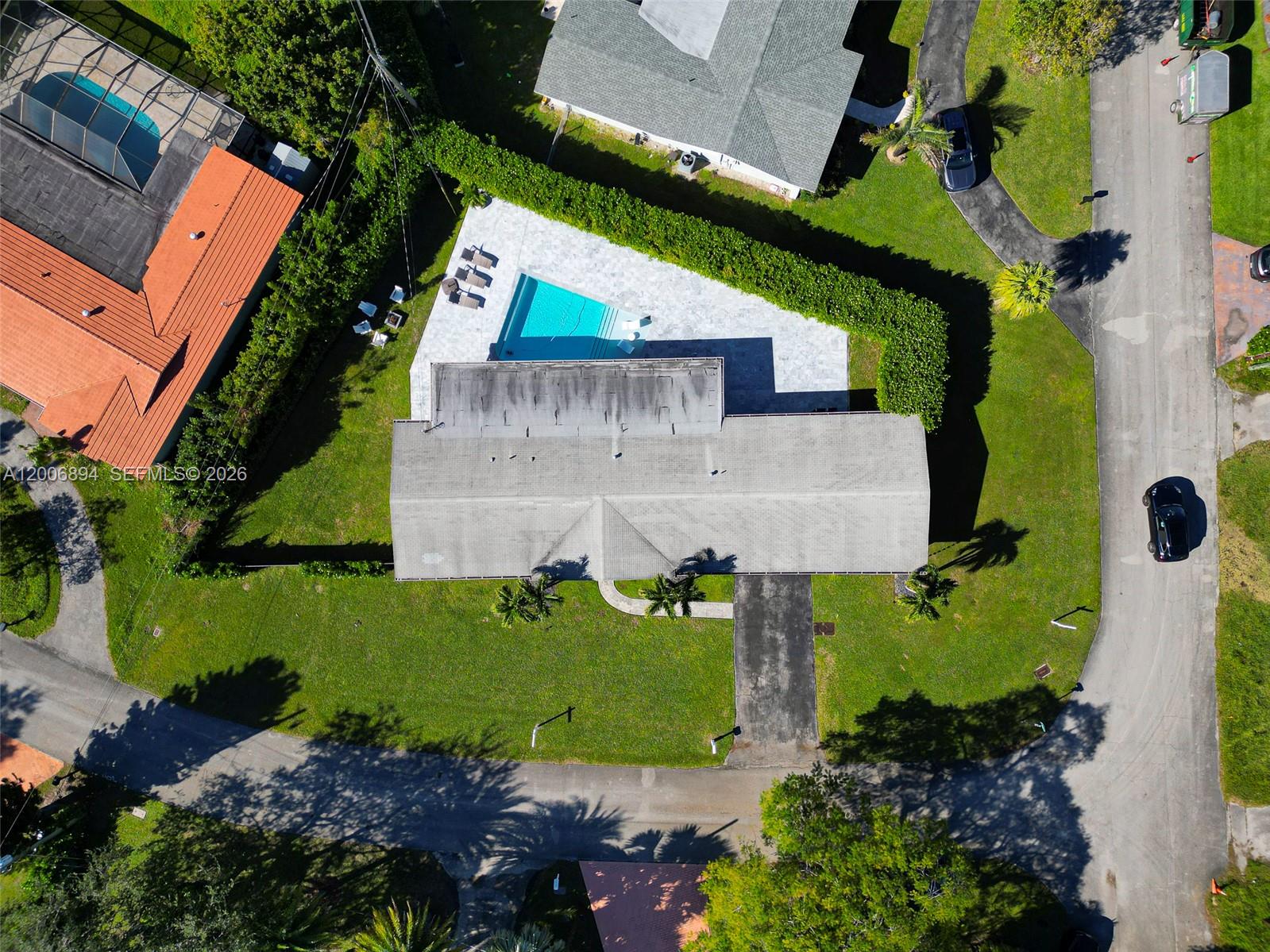 10600 Southwest 80th Court Miami, FL 33156 - Photo 47 of 51 an aerial view of a house with a yard and black swimming pool