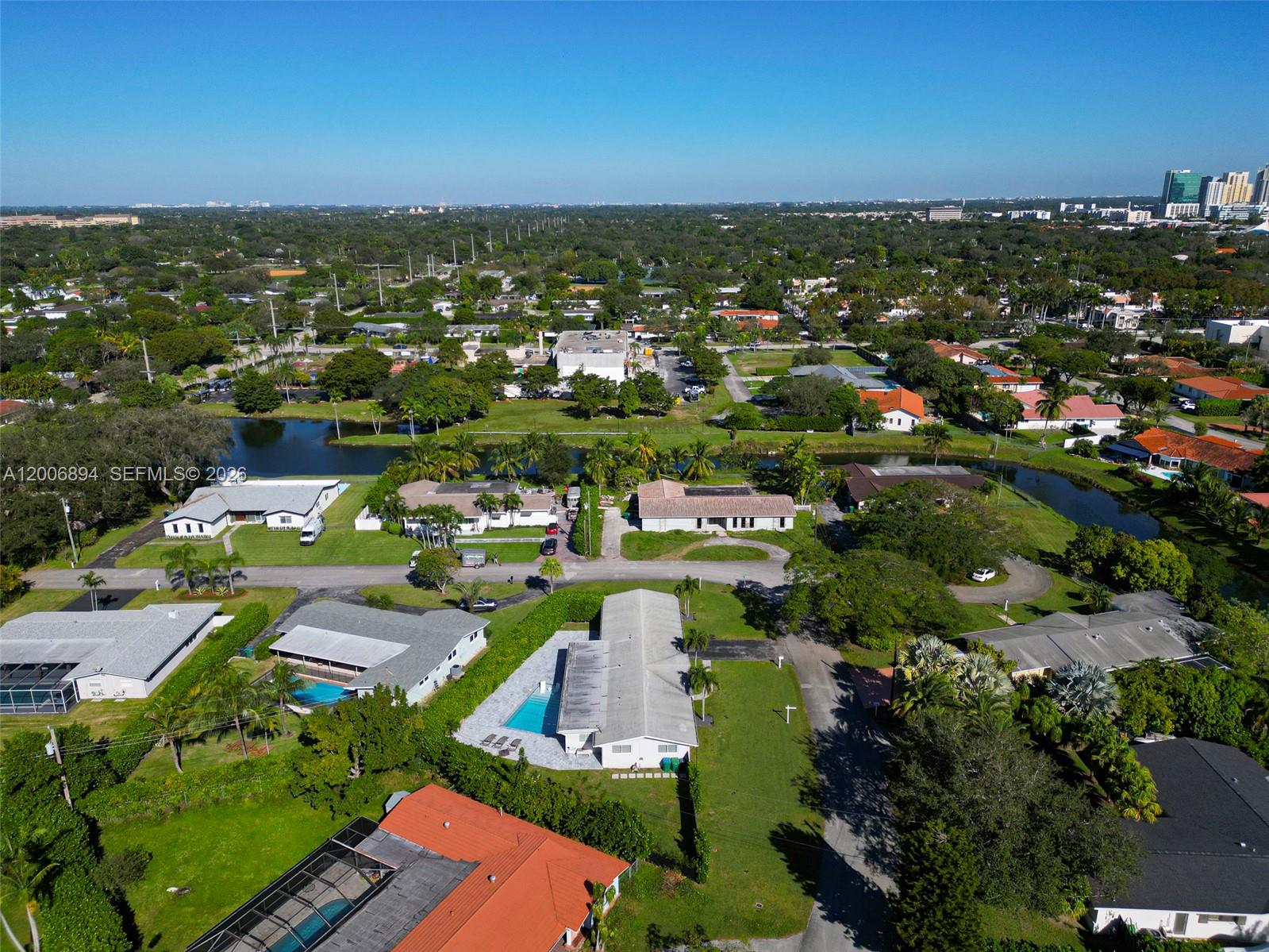 10600 Southwest 80th Court Miami, FL 33156 - Photo 51 of 51 an aerial view of a city with lots of residential buildings lake and ocean view