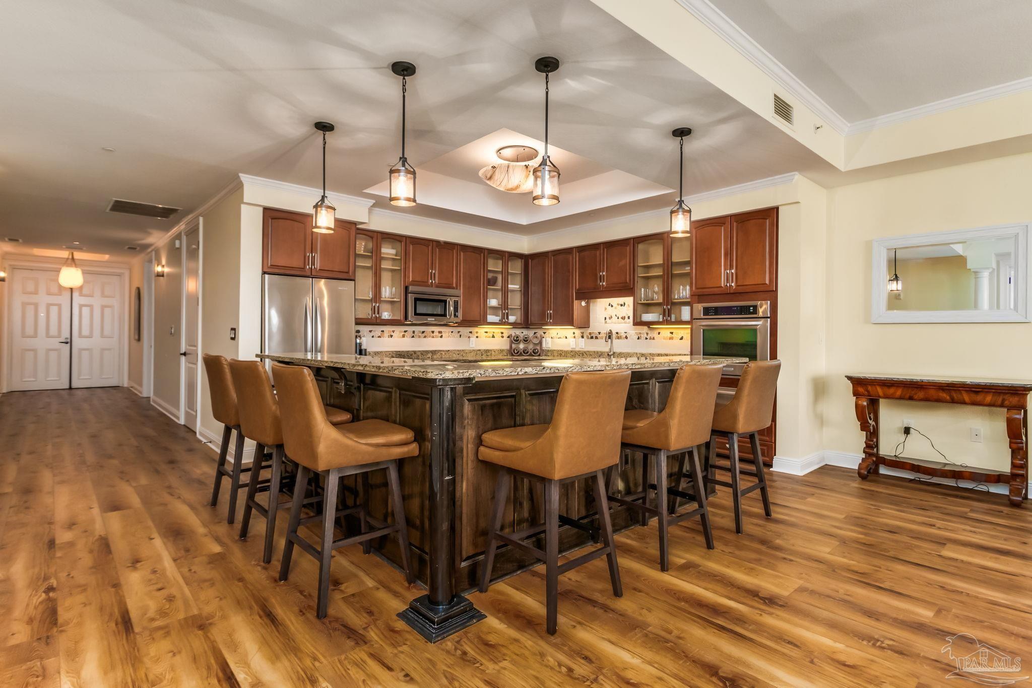 14500 River Road, Unit 406 Pensacola, FL 32507 - Photo 11 of 45 a view of a dining room with furniture window and wooden floor