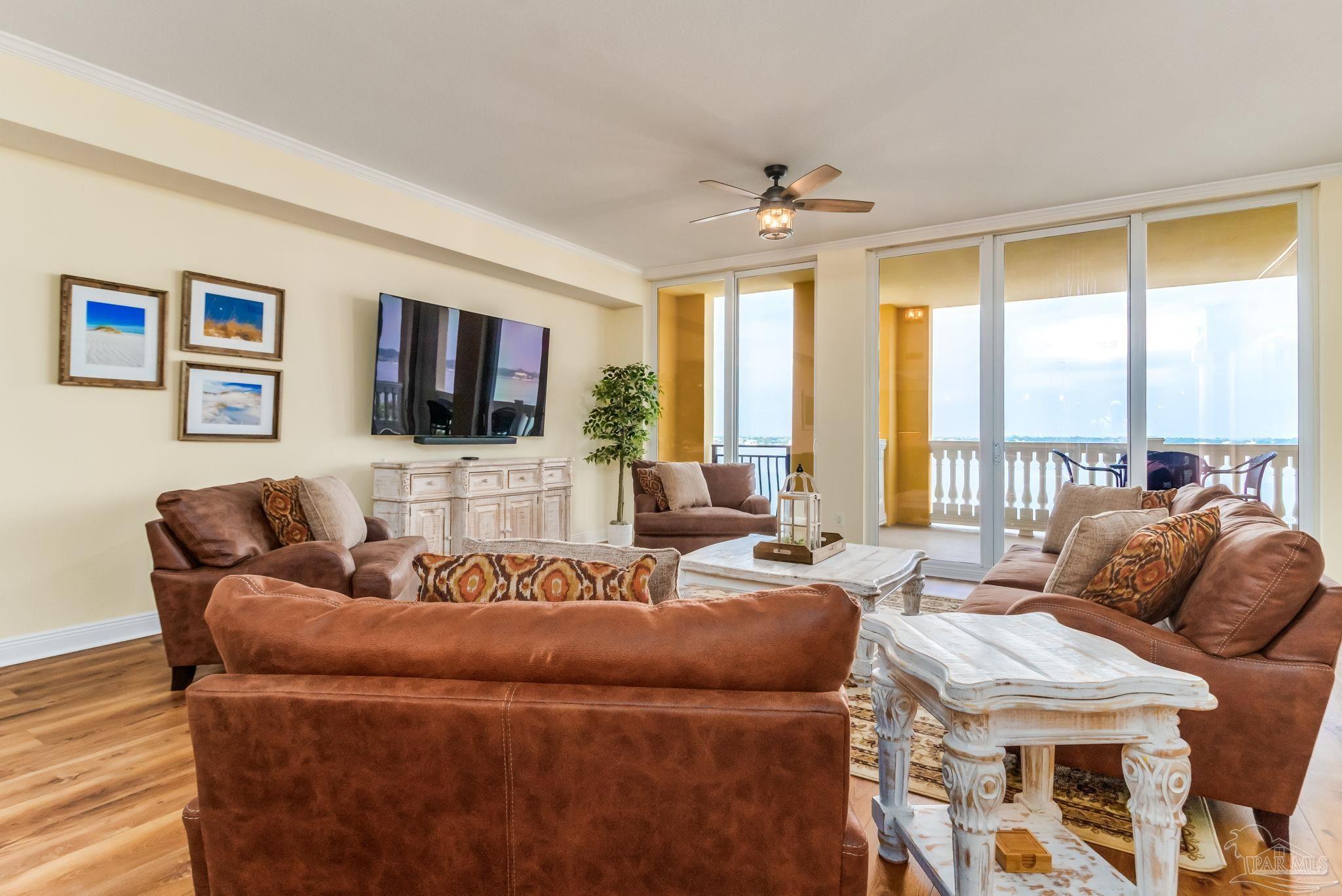 14500 River Road, Unit 406 Pensacola, FL 32507 - Photo 13 of 45 a living room with furniture and a flat screen tv