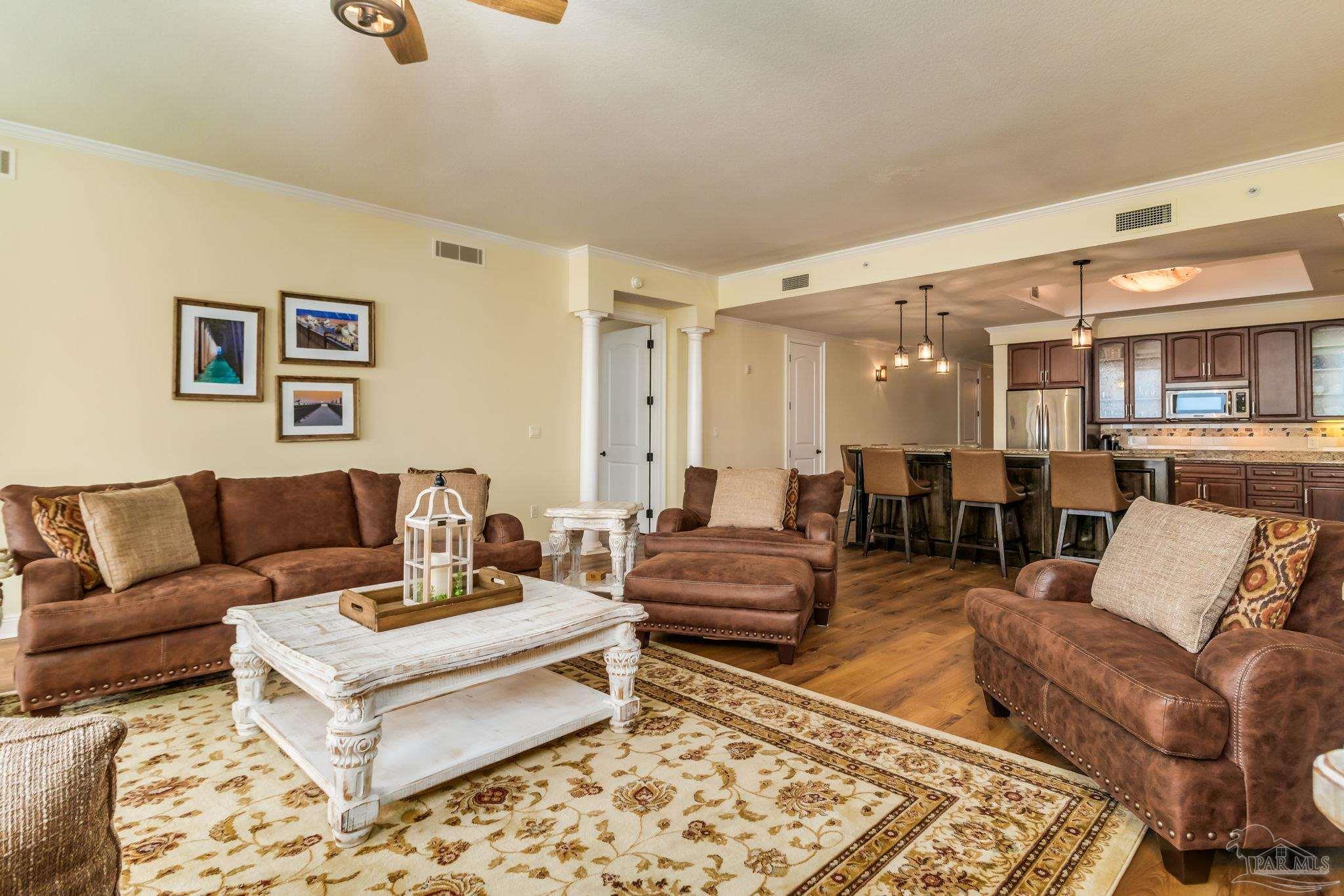 14500 River Road, Unit 406 Pensacola, FL 32507 - Photo 14 of 45 a living room with furniture wooden floor and a table