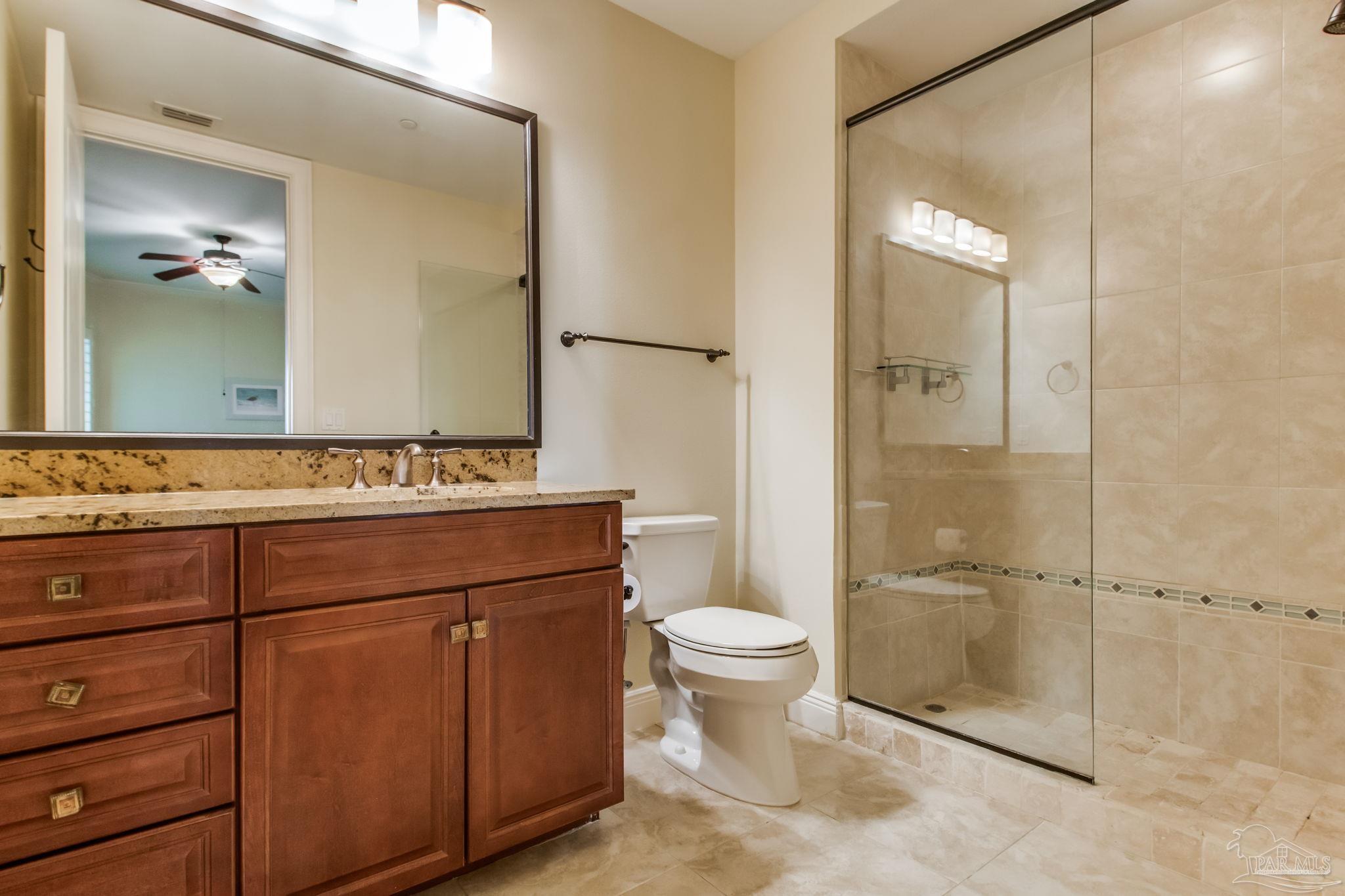 14500 River Road, Unit 406 Pensacola, FL 32507 - Photo 28 of 45 a bathroom with a sink a toilet and shower