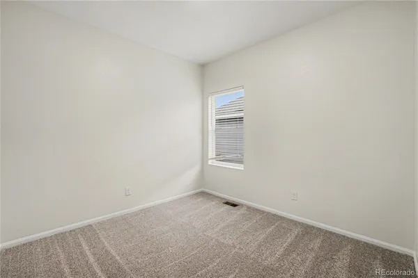 a view of a room that has a window in it