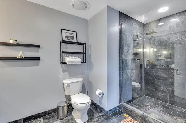 a bedroom with a bed and a view of balcony