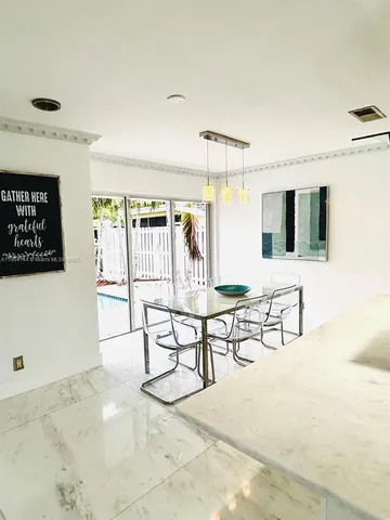 a view of a livingroom with furniture and a table