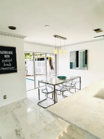 a view of a livingroom with furniture and a table