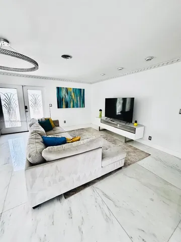 a living room with a couch and a flat screen tv