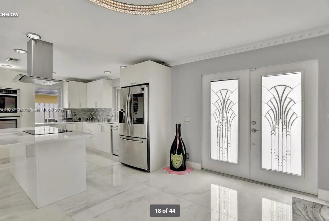 2321 Southeast 15th Street, Unit 2321 Pompano Beach, FL 33062 - Photo 2 of 26 a view of a kitchen with refrigerator and windows