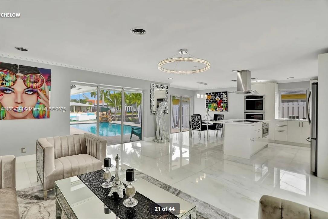 2321 Southeast 15th Street, Unit 2321 Pompano Beach, FL 33062 - Photo 22 of 26 a living room with furniture and a large window