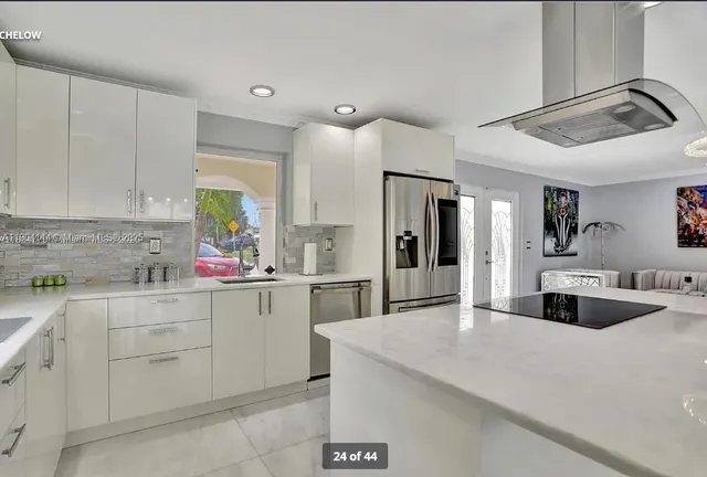 a kitchen with a sink cabinets and window