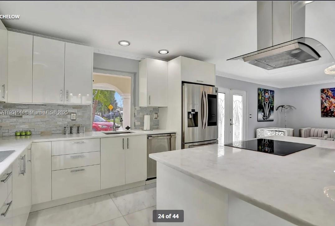 2321 Southeast 15th Street, Unit 2321 Pompano Beach, FL 33062 - Photo 9 of 26 a kitchen with a sink cabinets and window