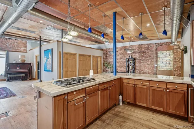 a kitchen with stainless steel appliances granite countertop a sink and cabinets