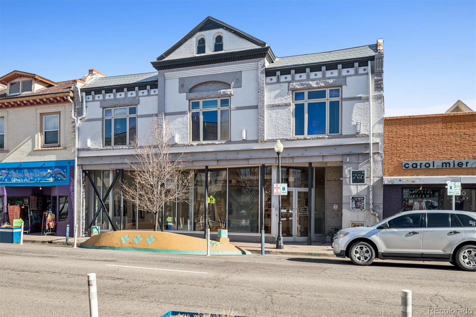 760 Santa Fe Drive, Unit 2 Denver, CO 80204 - Photo 2 of 33 a view of a building with car parked