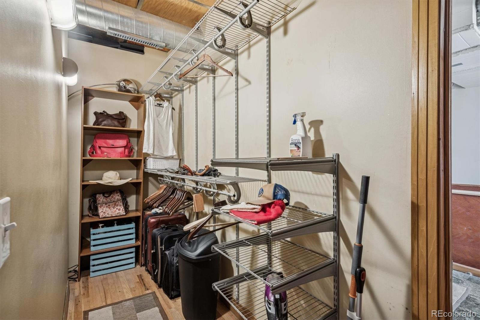 760 Santa Fe Drive, Unit 2 Denver, CO 80204 - Photo 27 of 33 a view of a dining room with furniture and chandelier