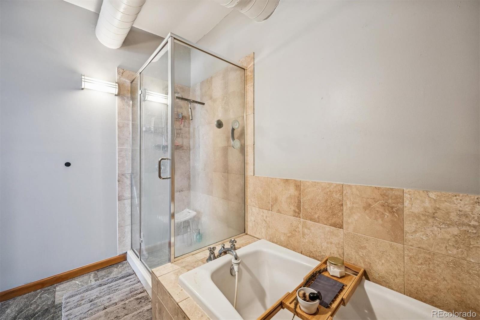 760 Santa Fe Drive, Unit 2 Denver, CO 80204 - Photo 29 of 33 a bathroom with a sink and shower