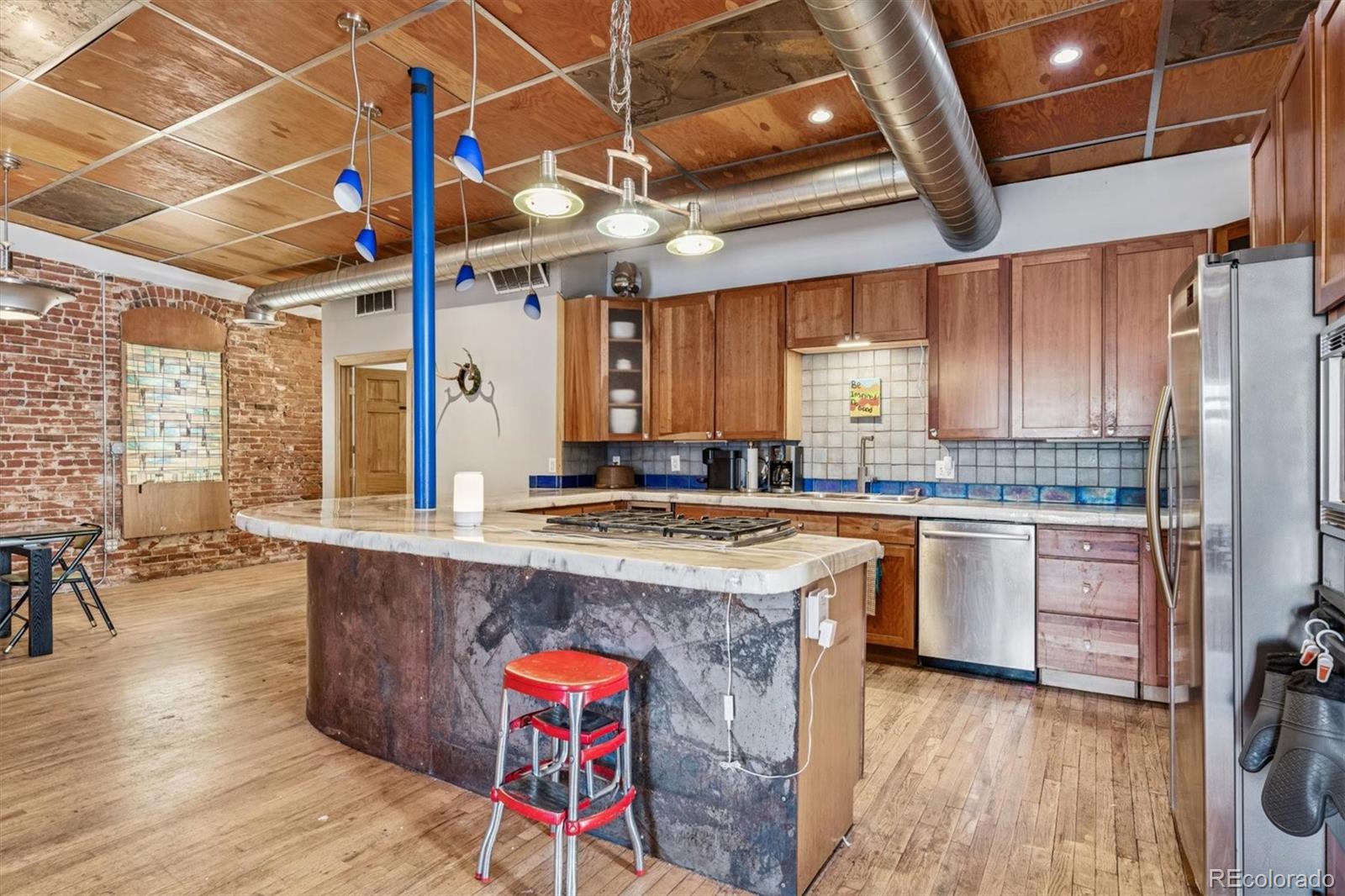 760 Santa Fe Drive, Unit 2 Denver, CO 80204 - Photo 8 of 33 a kitchen with stainless steel appliances granite countertop a sink a stove and refrigerator