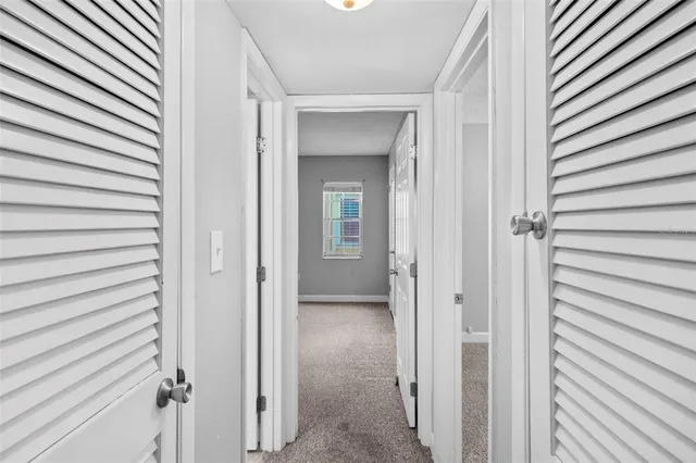 a bathroom with a granite countertop sink mirror toilet and bathtub