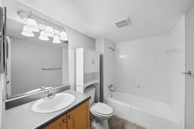 a view of a hallway with a white wall and roof