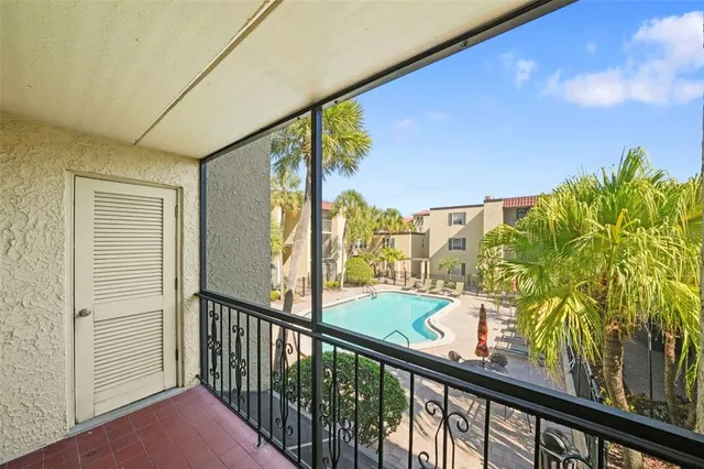 a view of swimming pool with outdoor seating and patio