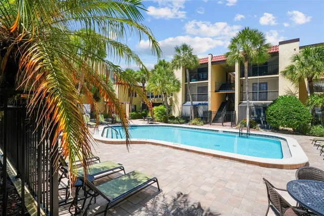 a view of a swimming pool with a patio