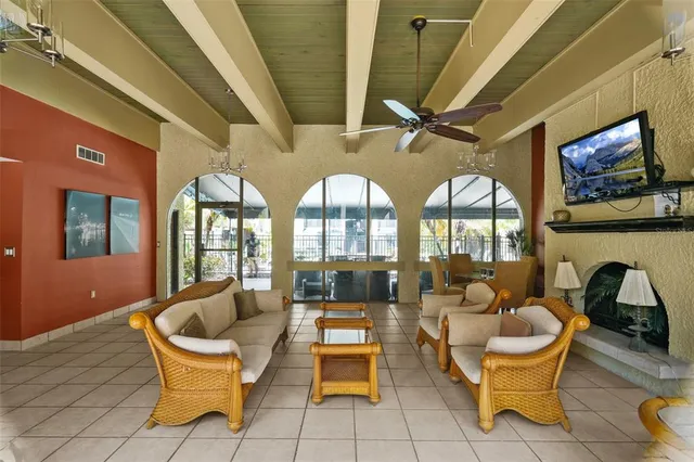 a living room with couches a table and chairs