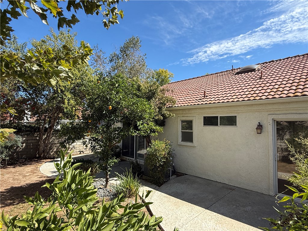 24315 Taranto Avenue Valencia, CA 91355 - Photo 19 of 21 a view of a house with a yard