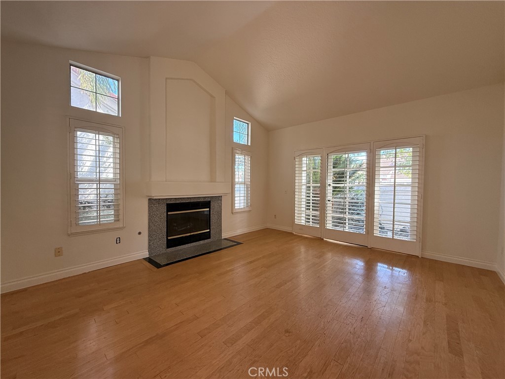 24315 Taranto Avenue Valencia, CA 91355 - Photo 3 of 21 a view of a livingroom with a fireplace