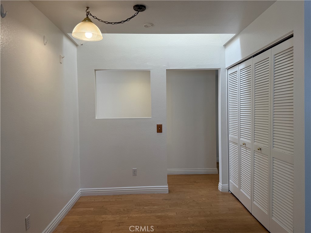 24315 Taranto Avenue Valencia, CA 91355 - Photo 6 of 21 an empty room with wooden floor and windows