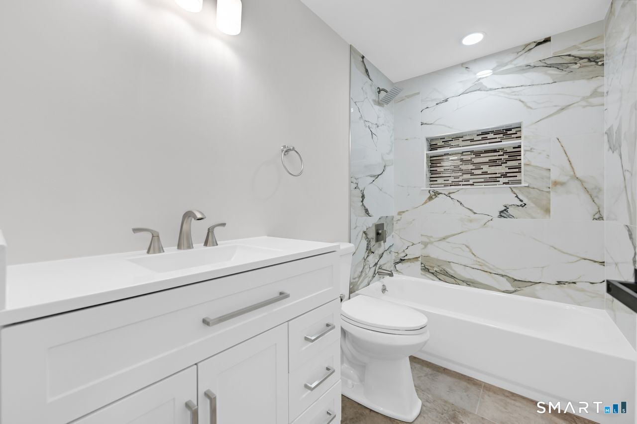 129 Midwell Road Wethersfield, CT 06109 - Photo 10 of 28 Beautiful remodeled full bath on the main level.