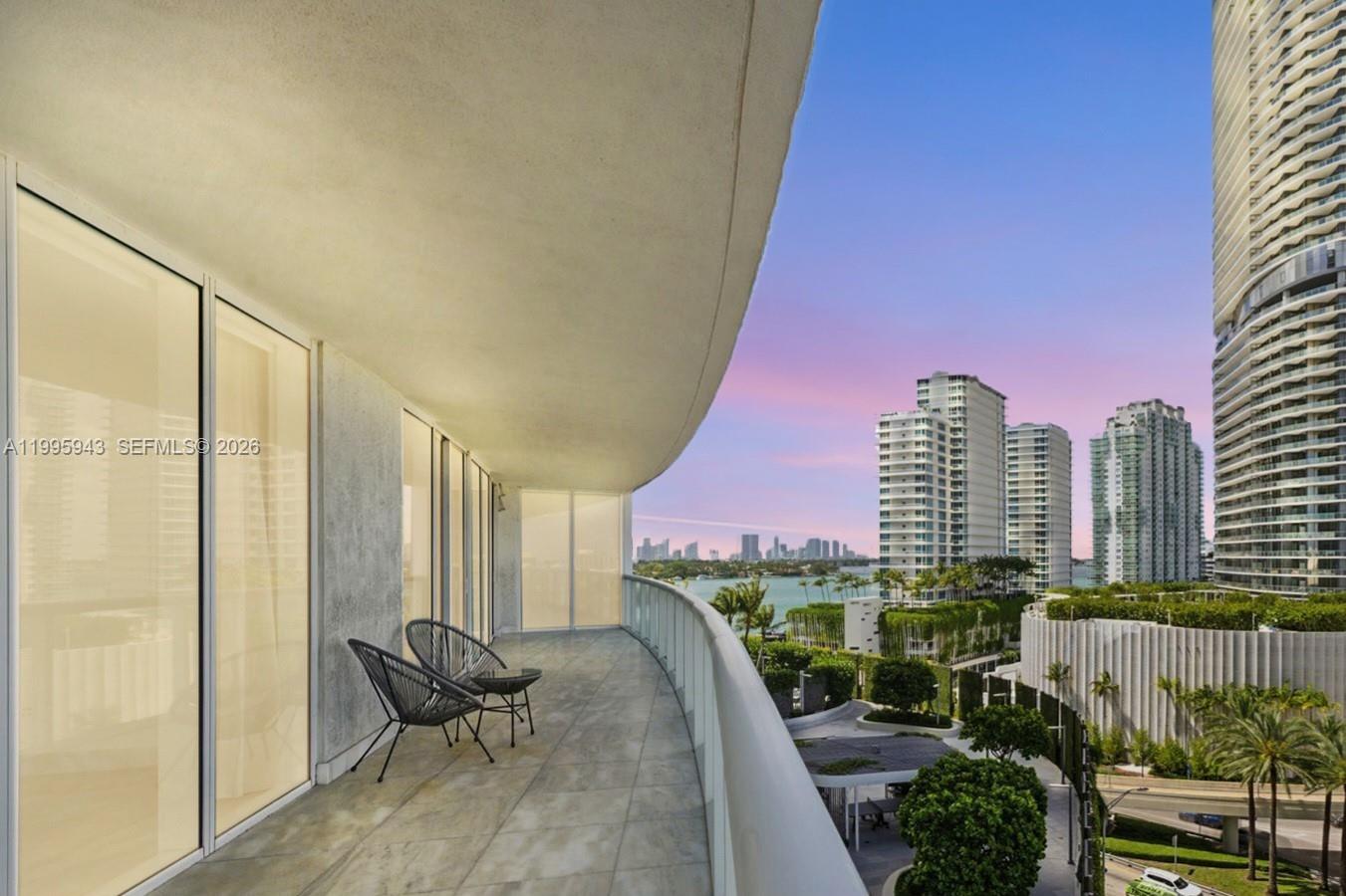 450 Alton Road, Unit 910 Miami Beach, FL 33139 - Photo 24 of 59 a city view with tall buildings and a bench