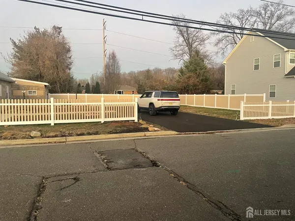 a view of a balcony with a floor to ceiling window and wooden fence