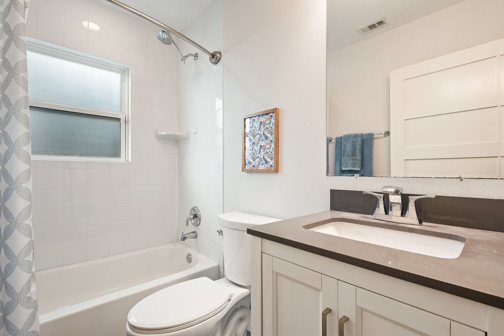 2702 Crest Avenue, Unit 1 Austin, TX 78702 - Photo 25 of 29 Stylish fixtures and clean lines create a fresh and contemporary feel in the guest bathroom.