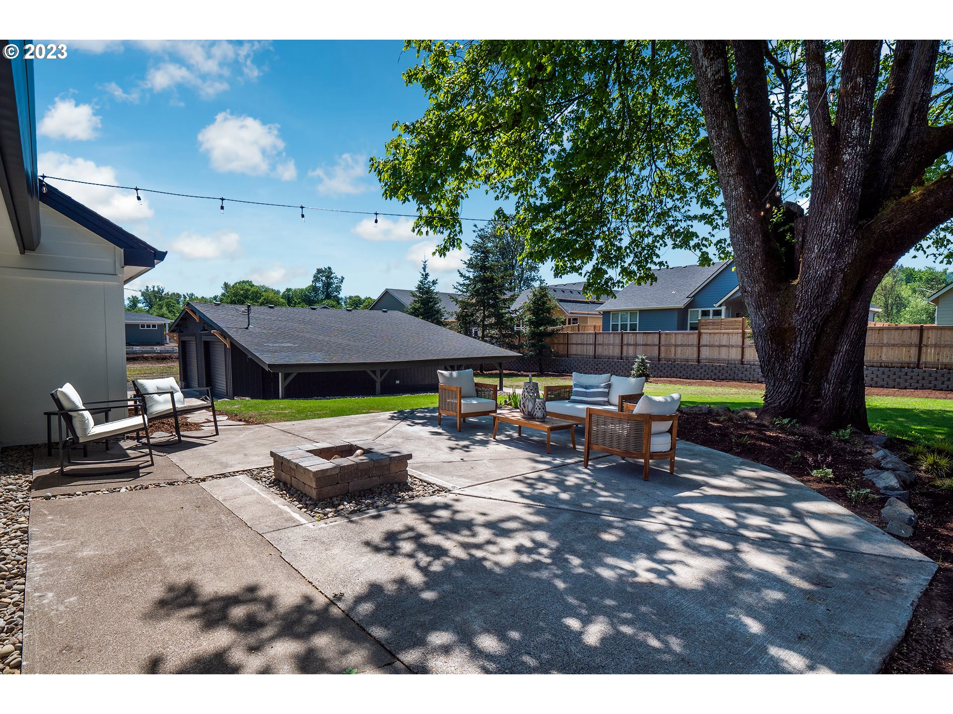 1050 Kintzley Avenue Springfield, OR 97478 - Photo 39 of 48 a backyard of a house with fire pit and outdoor seating