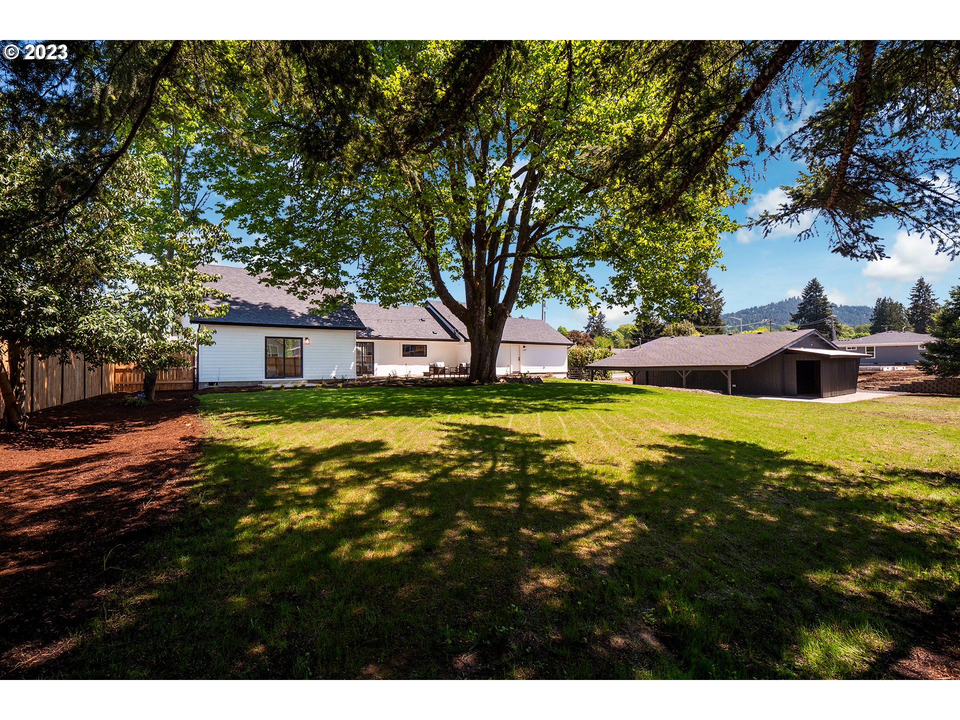 1050 Kintzley Avenue Springfield, OR 97478 - Photo 42 of 48 a view of an house with backyard and tree