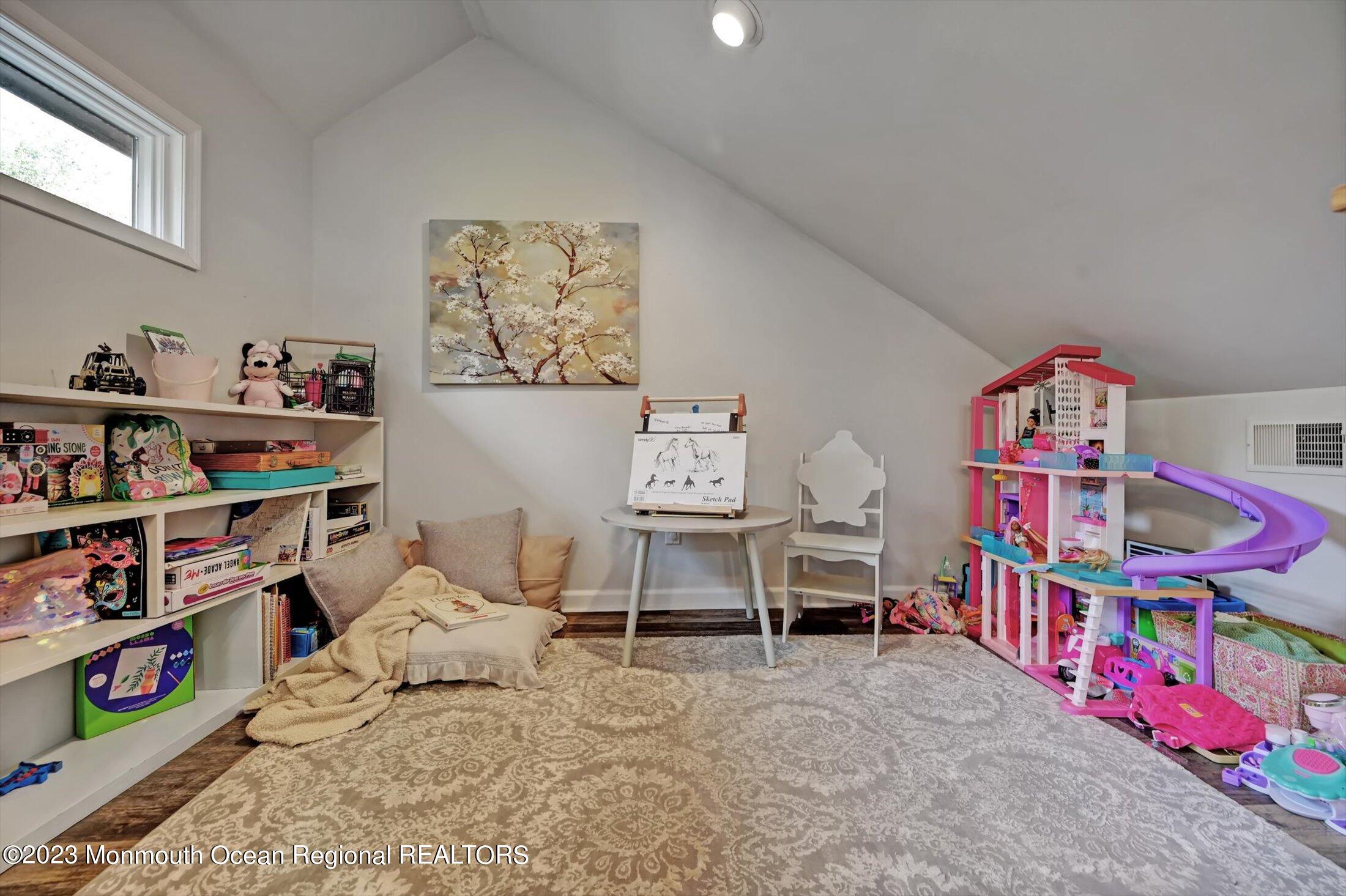 897 Fort Plains Road Howell, NJ 07731 - Photo 18 of 35 a bedroom with furniture a baby crib and a book shelf