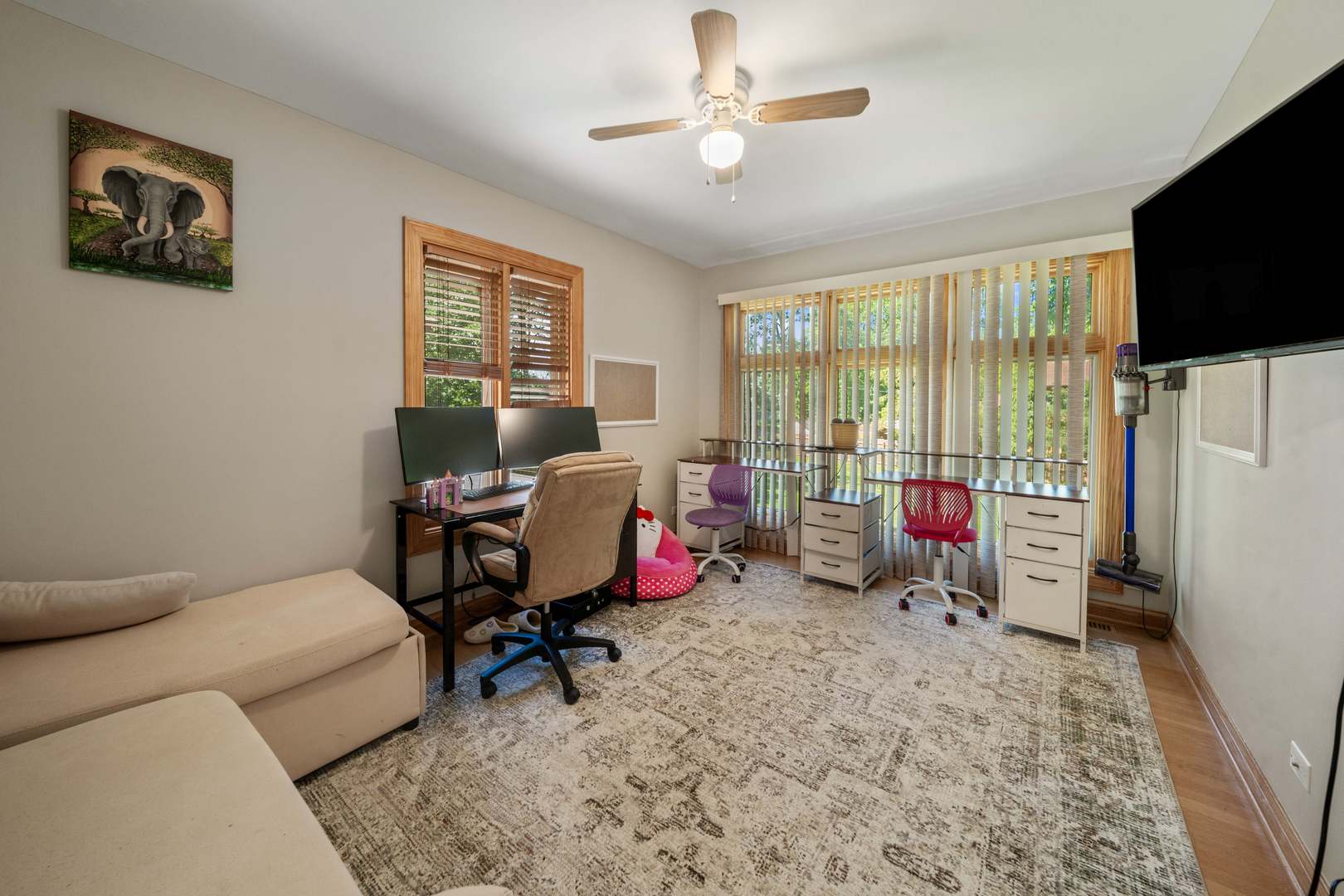 5N750 Medinah Road Medinah, IL 60157 - Photo 10 of 53 a living room with furniture a flat screen tv and a floor to ceiling window